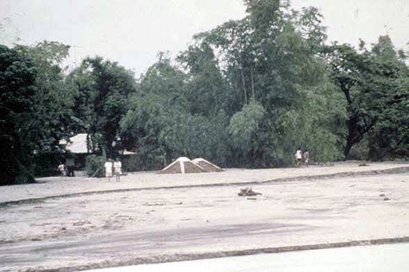 Image showing a house in the Philippines after a mudflow from Mt. Pinatubo.